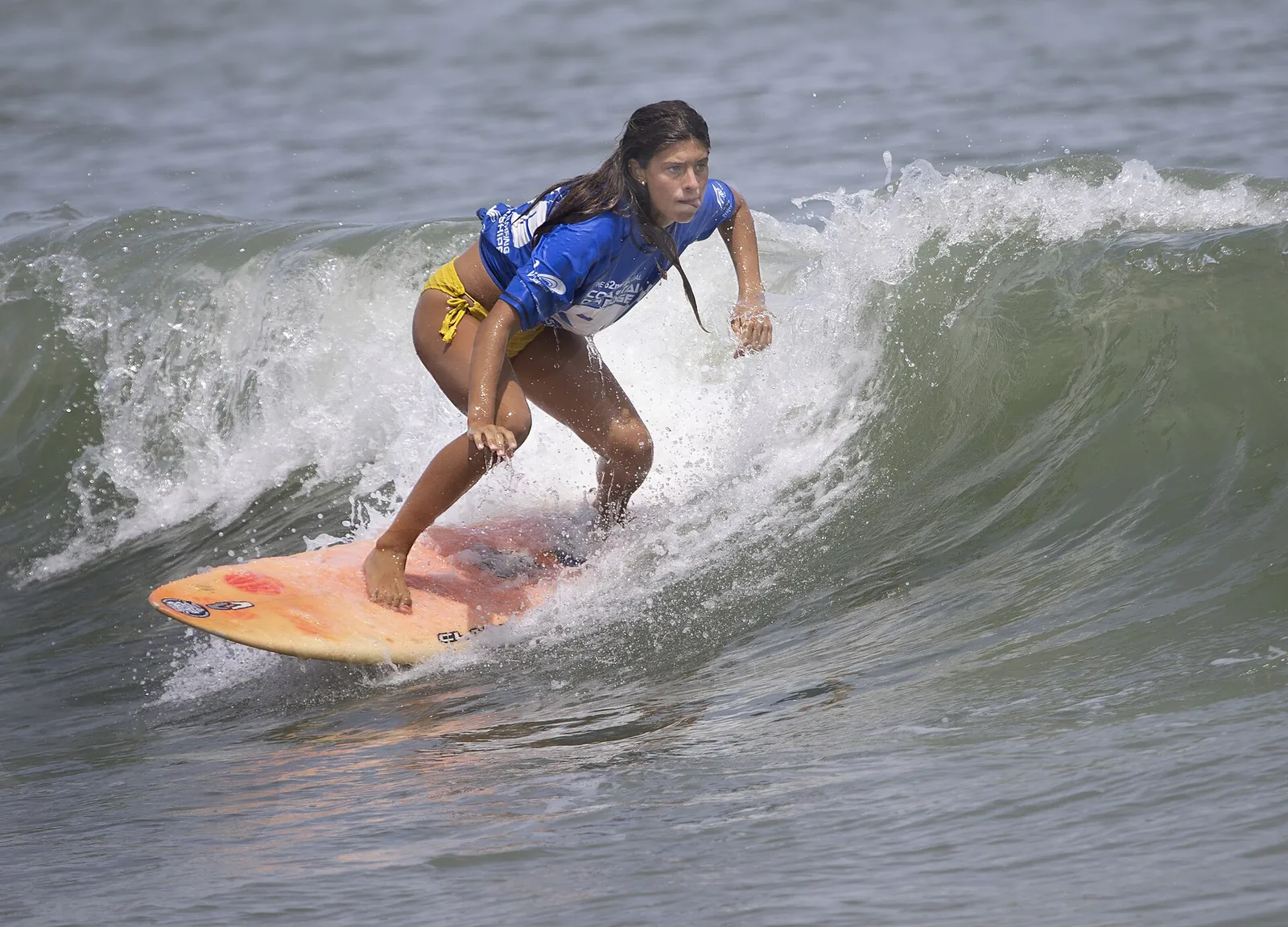 A competitor rides a wave during the East Coast Surfing Championships at the Virginia Beach Oceanfront.