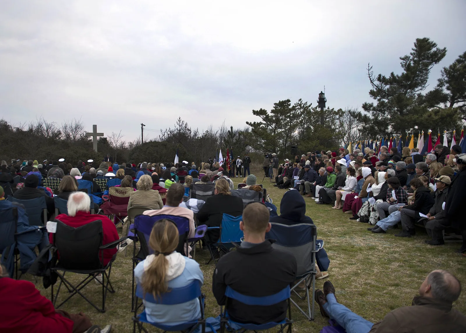 Guests in lawn chairs at the Easter sunrise service by the Cape Henry Memorial Cross on Joint Expeditionary Base Little Creek-Fort Story in Virginia Beach.