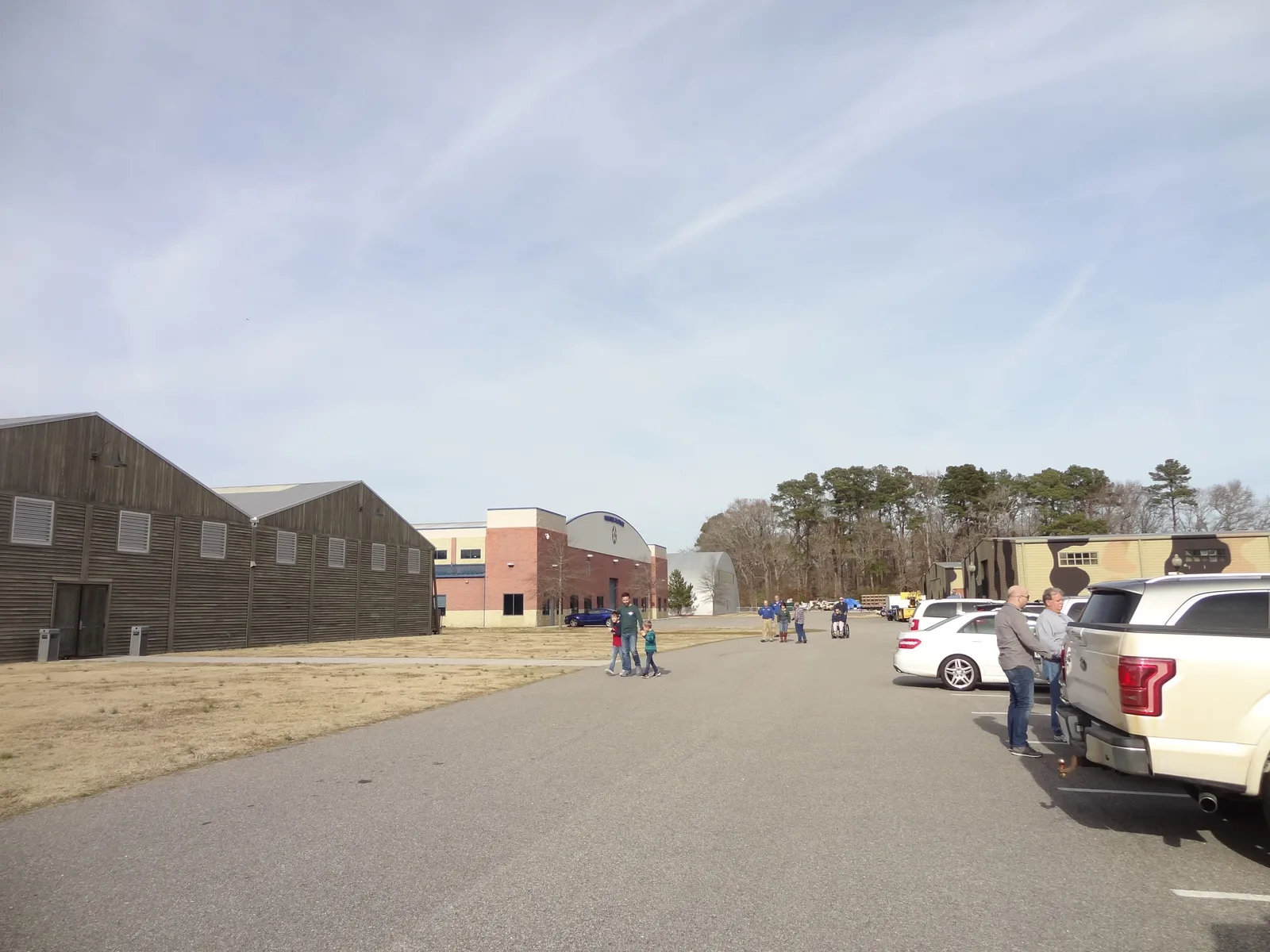 A father walks with two children past the hangars at the Military Aviation Museum on Princess Anne Road in Virginia Beach.