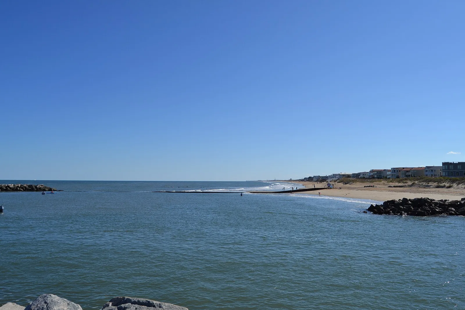 The mouth of Rudee Inlet at the south end of the Virginia Beach Oceanfront.